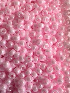 pink and white beads are stacked on top of each other