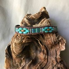 Unique, Southwestern inspired, handmade leather and beaded bracelet. This bracelet, is a single strand using Opaque Yellow Copper Picasso and deep turquoise tone Picasso SuperDuo glass beads, as well Matte Transparent Green Tila beads. They have been accented by Gilded Marble Turquoise colored seed Tila Bead Bracelets, Beaded Leather Bracelet, Deep Turquoise, Tila Beads, Bracelets Tutorial, Beaded Bracelets Tutorial, Wrap Bracelets, Bead Leather, Bead Bracelets