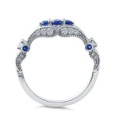 Top of ring height: 6mm

Band width: 1.9mm

Shank width: 1.6mm


 



Stone material: blue & clear cubic zirconia



Center stone size: 3.2mm



Stone size: round cut



Center stone carat weight: .11 ct



Total number of CZ stones: 29



Stone setting: prong setting



 



Metal: 925 sterling silver



Plating: rhodium plated 



Finish: high polish Blue Diamond Stackable Round Rings, Blue Diamond Round Stackable Rings, Sapphire Colored Cubic Zirconia Promise Ring, Sapphire Brilliant Cut Cubic Zirconia Ring, Blue Diamond Stackable Rings With Round Shape, Fine Jewelry Sapphire Colored Cubic Zirconia Rings, Cubic Zirconia Sapphire Ring With Brilliant Cut For Promise, Sapphire Diamond Ring With Cubic Zirconia Accents, Brilliant Cut Sapphire Birthstone Ring In Cubic Zirconia