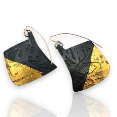 Gold & Steel Earrings - These earrings are made of steel that has been patinated black, giving them a dark, matte finish; they feature a distinctive etched design with a striking contrast between the black patinated steel and the vibrant 24k gold foil, applied using the ancient keum-bo technique. The earrings are asymmetrically shaped with irregular, angular forms, adding a modern and artistic touch. Gold-filled ear wires. Contemporary Black Jewelry With Oxidized Finish, Hand Forged Black Earrings For A Gift, Hand Forged Black Earrings As A Gift, Black Drop Earrings With Oxidized Finish, Line Earrings, Butter Shrimp, Porcelain Earrings, Artful Home, Paper Jewelry