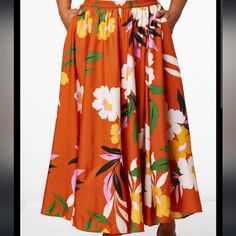 You'll Turn Heads In This Silky Skirt With Burnt Orange Background And Bold Floral Print. * Long Skirt * Elastic Waist * 100% Polyester * Machine Wash * Imported Spring Vacation Full Skirt, Spring Vacation Full Skirt Bottoms, Vacation Full Skirt For Spring, Chic Orange Floral Print Skirt, Floral Print Full Skirt Bottoms For Day Out, Vacation Floral Print Full Skirt Bottoms, Orange Floral Print Skirt For Day Out, Floral Print Full Skirt Bottoms For Vacation, Floral Print Full Skirt For Vacation