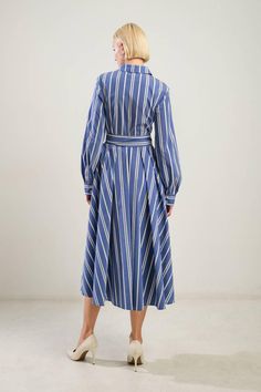 Long sleeves, striped, midi shirt dress with self belt. Available in blue/white/gold. 65% Cotton, 32% Nylon, 3% Spandex US Size (Bust - Waist - Hips) Small 2-4 (34 - 26 -36) Medium 6 (36 - 28 -38) Large 8-10 (38 - 30 -40) Shirt Midi Dress, Outerwear Trends, Flying Tomato, Affordable Dresses, Midi Shirt Dress, Vintage Inspired Design, Sweatshirt Dress, Stripes Design, Striped Shirt