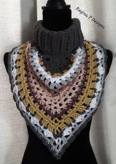 a crocheted triangle shawl on a mannequin