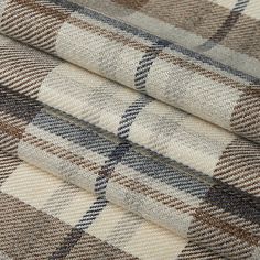 three different plaid fabric patterns on top of each other, one in brown and white