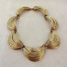 "Chic Sculptural Crescent Wire Statement Collar Necklace c. 1970s  -Scalloped wire collar necklace -Hook closure  -Shiny gold tone finish -Unsigned  -Excellent vintage condition, links are soldered closed, high quality  -Size: approximately 16 1/2\" from end to end, crescents are approximately 1 1/2\" wide" Vintage Gold Choker For Formal Occasions, Vintage Gold Chain Necklace For Evening, Gold Retro Necklace For Evening, Wire Collar Necklace, Retro Gold Chain Necklace For Formal Occasions, Gold Retro Chain Necklace For Formal Occasions, Mid-century Gold Jewelry For Evening, Vintage Metal Choker For Evening, Retro Gold Metal Necklace