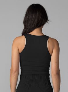 The BDlab Sportswear Every Day Tank is a four-way stretch, form fitting tank that can be worn as a top layer over a sports bra for workouts or on it's own to elevate your every day style. Constructed with a Sustainable Ribbed Tencel™ Modal fabric meticulously sewn in NYC. Style it over our Cross Back Sports Bra for workouts or pair with our Cargo Pant, Flared Trouser, Adventure Short or Midi Skirt for a polished, elevated look. Four-way stretch Sustainable Ribbed Tencel™ Model with Spandex 90% T Black Tank Top With Built-in Bra For Workout, Black Workout Tank Top With Built-in Bra, Sporty Tops With Built-in Bra And Minimal Stretch, Black Tank Top With Built-in Bra For Loungewear, High Stretch Black Bra Friendly Tops, Black High Stretch Bra Friendly Tops, High Stretch Black Bra-friendly Tops, Black High Stretch Bra-friendly Tops, Workout Tops With Minimal Stretch And Bra Friendly