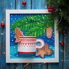 a christmas card with an image of a mug and gingerbreads