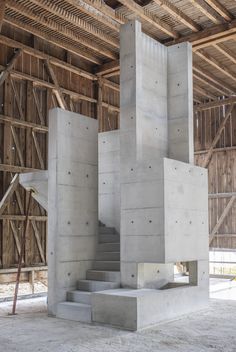 the inside of a building with concrete stairs