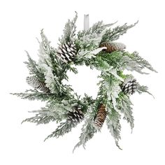 a christmas wreath with pine cones and evergreen needles