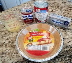 ingredients to make cake sitting on top of a granite countertop, including butter, jelly and other toppings