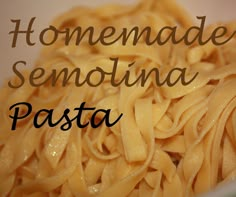 a bowl filled with pasta sitting on top of a table next to the words homemade semiotina pasta