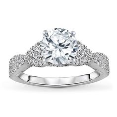 a white gold engagement ring with diamonds on it