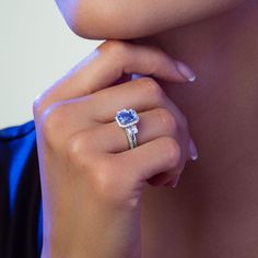 a woman's hand with a ring on her finger