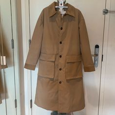 This Piece Features A Cord Collar, Button-Front Closure, And Two Front Pockets. Lined Interior. Warm Padding - Perfect For Fall And Winter. Size: S Color: Beige / Camel Not Zara, Brand Used For Visibility Only. Utility Single Breasted Outerwear With Lapel Collar, Utility Single-breasted Outerwear With Lapel Collar, Beige Gabardine Outerwear With Button Cuffs, Collared Khaki Outerwear For Work, Single Breasted Utility Outerwear With Lapel Collar, Spring Outerwear With Covered Buttons, Spring Solid Outerwear With Covered Buttons, Beige Utility Jacket With Buttons For Winter, Beige Stand Collar Outerwear With Buttons