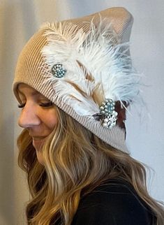 Unique Feathered Jeweled Knit Hat: Sparkly Boho Winter Accessory. Embellished Feathered & Jeweled Knit Hat. Custom "One of a Kind" embellished knit hats.  FOR MORE INFO. Find us at: rrdesignartistry.myshopify.com instagram.com/rrdesignartistry   Like what you see, Like us at & subscribe Not often do I recreate an identical design...? On the occasion there is a rare duplicate Sister Hat, you can choose from a Left Sided Design from Right Sided Design. Each creation is unique in it own way. There will always be multiple variations of feathers used; peacock, pheasant, rooster, and more. Then intricately hand trimmed, as the vision beings to unfold, each feather is slowly pieced together one by one. This creating a layering effect with the feathers creating visual interest with dimension. Some Hat With Feather, Veiled Hats, Boho Winter, Skull Hat, Hair Scarf Styles, Chanel Inspired, Hat Custom