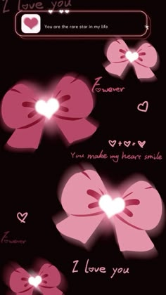 some pink bows with hearts on them and the words i love you written in white