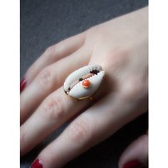 A reminder that sunny days are on the horizon, this stunning ring is carefully handmade from 18k gold over sterling silver wrapping a white cowrie shell marked with a pretty coral bead. Style it with similar styles from the Marina collection. Presented in a Vintouch signature packaging. Handmade from 18-karat Yellow Gold Over Sterling Silver (1-micron plating). We suggest to avoid contacts with soaps, detergents, chlorine and any other chemical substance that could alter the original characteris Handmade Oval Jewelry For Beach, Unique Gold Jewelry For Vacation, White Shell Jewelry Gift, White Beach Ring Jewelry, White Shell-shaped Rings For Beach, Handmade Shell Ring For Beach, Handmade White Shell Jewelry, White Rings For Summer Gifts, White Rings Suitable For Summer Gifts