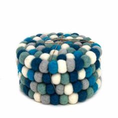 a stack of blue and white pom - poms on top of each other