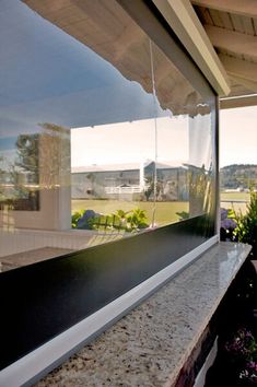 the reflection of trees and buildings in windows