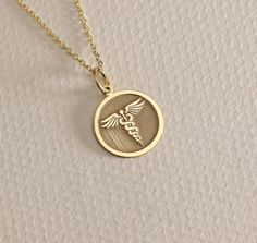 14K Real Solid Gold Medic Disc Pendant ● Material of pendant: Solid Gold 14k ( REAL GOLD ) ● Metal Stamp: 14L ( REAL GOLD ) ● The pendant is available in 6 sizes: - 14,0 mm / 0,55 inches ( Diameter ) In the photos - 15,3 mm / 0.60 inches ( Diameter ) - 16,5 mm / 0,65 inches ( Diameter ) - 19,1 mm / 0,75 inches ( Diameter ) - 21 mm / 0,82 inches ( Diameter ) - 23 mm / 0.90 inches ( Diameter ) ( In the photos the size is 14mm / 0.55 inches Diameter ) ( Jump Ring inner diameter: 4 mm ) ● Material O Gold Custom Round Necklace For Formal Occasions, 14k Gold Medallion Jewelry With Charms, 14k Gold Hallmarked Medallion Jewelry, Gold Medallion Sterling Silver Custom Necklace, Custom Round Gold Necklace Engraved, 14k Gold Tarnish Resistant Custom Necklace, Symbolic White Gold Jewelry Stamped 14k, Custom Gold Necklace With Polished Finish For Anniversary, Symbolic White Gold 14k Stamped Jewelry