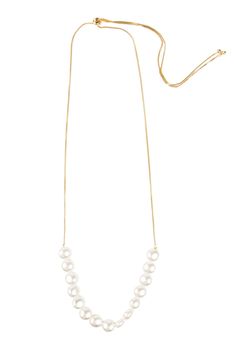 We've updated the classic pearl necklace by incorporating an adjustable slide closure - making it super easy to wear long or short. Our Motee Necklace is elegant and timeless, and perfect for any occasion. Materials: Gold Plated, Pearls, Copper Size :18" x 0.25" Adjustable Cord Imported Adjustable Pearl Charm Necklace For Formal Occasions, Adjustable Pearl Chain Necklace For Formal Occasions, Pearl Chain Long Necklace For Formal Occasions, Formal Long Pearl Necklace With Pearl Chain, Classic Long Pearl Necklace With Pendant, Formal Adjustable Pearl Necklace With Pendant, Chic Pearl Necklace With Adjustable Chain, Chic Adjustable Pearl Necklace, Classic Adjustable Pearl Necklace With Pearl Chain