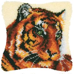 a close up of a tiger pillow on a white background