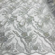 Dress up your special occasion with Lace USA's Beaded Lace Fabric Embroidered on 100% Polyester Net Mesh. This high-end, elegant fabric is perfect for making timeless beautiful couture lace pieces. Create a one-of-a-kind bridal lace, evening dress lace, quinceanera dress lace, or dance costume lace with decorative lace, beaded lace, and embellished lace crafted from this luxurious fabric. Showcase your creativity with our wedding dress lace and formal dress lace to make a statement that will las Quinceanera Crown, Lace Crafts, Beaded Lace Fabric, Elegant Fabric, Embroidered Lace Fabric, Lace Formal Dress, Quinceanera Dress, Luxurious Fabric, Lace Evening Dresses