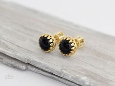 Gold stud earrings with natural black onyx. Made of 585/14k solid gold (rose, yellow or white - your choice). Stud size is 7 mm. Luxury Black Gemstone Earrings, Black Pierced Earrings In Fine Jewelry Style, Black Pierced Earrings Fine Jewelry, Fine Jewelry 14k Gold Black Earrings, Black Enamel Earrings For Gift, Fine Jewelry, Formal Black Cabochon Jewelry, Black Polished Finish Fine Jewelry Earrings, Elegant Yellow Gold Studs For Gift, Elegant Yellow Gold Studs As Gift