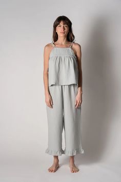 Not just for sleeping, this 100% organic gauze cotton lounge set is soft, lightweight and breathable. Perfect to wear on a summer day or evening! Wear to the beach or just relaxing at home. Made with adjustable shoulder ties and a drawstring waist for added comfort. Finished with contrast scalloped edges and a yoke sea Relaxed Cotton Sleepwear For Summer, Summer Vacation Sleepwear With Ruffles, Summer Vacation Ruffled Sleepwear, Linen Sleepwear For Spring, Chic Summer Cotton Sleepwear, Spring Linen Sleepwear For Loungewear, Spring Linen Loungewear Sleepwear, Summer Sleepwear With Ruffles For Loungewear, Summer Ruffled Sleepwear For Loungewear