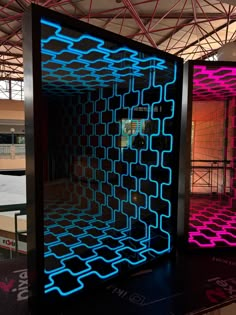 This image showcases an impressive infinity mirror design featuring two mirrored panels with a futuristic, tunnel-like effect. The panels, one in vibrant blue and the other in bright pink, create an optical illusion of endless depth, making it appear as though the patterned grid extends infinitely into the distance. The contrasting colors add a dynamic and visually striking effect, perfect for creating a modern, high-tech aesthetic. The infinity mirror design is ideal for use in gaming rooms, modern interior spaces, or as a statement piece in creative environments. Its ability to play with depth and light makes it an engaging and mesmerizing addition to any room. 🛠️ Expert Craftsmanship 📏 Customizable Sizes 🔨 Easy Installation Equipped with easy-to-hang mounting hardware, it can be effo Illusion Decoration, Futuristic Decoration, Futuristic Tunnel, Infinite Mirror, Infinity Mirror Room, Studio Room Design, Led Light Decor, Futuristic Lighting, Infinity Mirrors