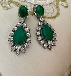 Emerald Green Diamond Earrings will be your perfect mate for the evening! Sparkle in this luxurious pair of Victorian earrings which are sure to make heads turn.  Details: Earrings Length-3 Inches Weight of Each Earring-23 grams All products are manufactured using traditional skills from our rich heritage of crafts.  The process of these crafts is essentially manual. Hence, any irregularities or variations are an inherent part of these handcrafting processes. Victorian Style Earrings For Party, Victorian Earrings For Pierced Ears For Party, Ornate Jeweled Party Earrings, Victorian Style Drop Earrings For Party, Elegant Green Jeweled Bridal Earrings, Victorian Dangle Earrings For Party, Victorian Green Earrings For Wedding, Hand Set Crystal Earrings For Party, Ornate Teardrop Earrings For Parties