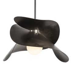 a black lamp hanging from the ceiling with an abstract design on it's side