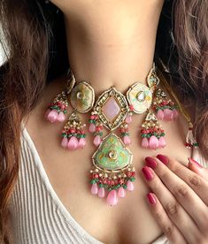 Adorn yourself in timeless elegance with this exquisite soft pink and mint green fusion necklace set, perfect for weddings and special occasions. Crafted with meticulous attention to detail, the set features delicate pink and green hues reminiscent of Pakistani and Punjabi traditions, with a touch of Bollywood glamour. Complete with matching earrings this Indian Kundan ensemble effortlessly captures the essence of sophistication and grace. Measurements: Necklace weight: 140 gms  Necklace Length- Nikah Jewellery, Indian Kundan Jewellery, Meenakari Jewellery, Meenakari Necklace, Bollywood Glamour, Necklace Set Indian, Ceramic Jewellery, Pink And Mint, Back Necklace