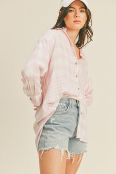 The oversized button-up shirt effortlessly blends comfort and fashion-forward style. With its loose and relaxed fit, it offers a laid-back yet chic vibe that can be easily dressed up or down. Whether paired with leggings for a cozy day in or knotted at the waist over shorts for a trendy look, the oversized button-up shirt is a versatile addition to any casual wardrobe.Size + Fit (inch):S: 23.0 (Bust), 30.5 (Length)M: 23.5 (Bust), 31.0 (Length)L: 24.0 (Bust), 31.5 (Length) Oversized Button Up Shirt, Distressed Denim Skirt, Denim Trends, Plaid Jacket, Wardrobe Style, Knit Tees, Pink Plaid, New Tops, Chic Boutique