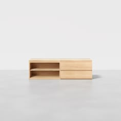 the sideboard is made out of wood and has two open shelves on one side