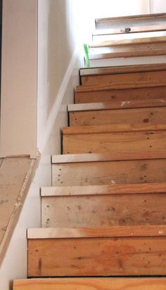 the stairs are made of wood and have no railings or rails on each side