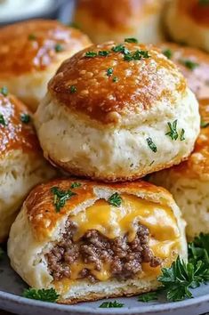 Garlic Parmesan Cheeseburger Bombs are cheesy, savory snacks wrapped in golden biscuit dough. Try this easy recipe today! Cheeseburger Rolls, Biscuit Dough, Snacks Für Party, Garlic Parmesan, Savory Snacks, Ground Beef Recipes, Appetizer Snacks, Cheeseburger, Meal Ideas