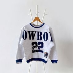 90s Dallas Cowboys NFL sweatshirt/ Kids * PLEASE READ BEFORE PURCHASE * PLEASE consider the PHOTOS before making the decision * The images may DIFFER in appearance from the actual product because we took pictures under daylight.  * PLEASE send your PHONE NUMBER after your purchase for the shipping company to contact you X No returns X No refund Condition : 9/10 More details : look at the pictures  Brand : Legends  Size :  Pit to pit/ Chests : 20/40 inches  Length : 23.5 inches  Material : cotton polyester  Color : gray * ALL ITEMS are VINTAGE which may show some signs of wear and tear * Due to the different display and different light, the picture may not reflect the actual color of the item * Please, remember that our items are vintage so they may show some signs of wear, tear and yellow Athleisure Outfits Casual, Dallas Cowboys Svg, Personalised Fans, Nfl Sweatshirt, Bulldog Sweatshirt, Baby Jumpers, Vintage Dallas Cowboys, Cowboys Svg, Hockey Sweatshirts