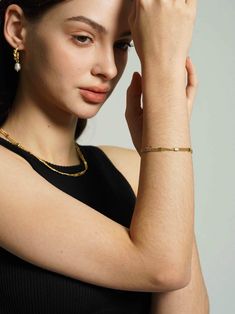 Enhance your bracelet collection with this striking 18K gold-plated layered chain bracelet, featuring rows of meticulously textured beads that offer a luxurious feel. A versatile addition for an effortlessly chic stacked look. Elegant 14k Gold-filled Yellow Gold Paperclip Bracelet, Layering 14k Gold-filled Yellow Gold Bracelets, 14k Gold Filled Bracelets For Layering, Elegant Formal Bracelets With Beaded Chain, Elegant Gold Beaded Bracelets With Chain, Dainty Tarnish Resistant Chain Bracelet For Everyday Luxury, Elegant Formal Bracelet With Beaded Chain, Gold Tarnish-resistant Bracelets For Layering, Gold Jewelry With Jubilee Bracelet For Layering