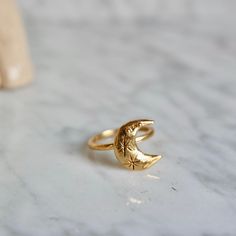 This ring is handmade by me and moulded bronze. Ring size is adjustable you can use for your every finger. Ring is 18 k gold. Crescent size is: 1.5 cm in height. Adjustable Crescent Moon Phase Ring, Handmade Celestial Gold Plated Jewelry, Adjustable Moon Phase Ring For Gift, Celestial Style Open Ring With Moon Charm, Minimalist Moon Charm Rings For Gifts, Minimalist Moon Charm Rings As Gift, Minimalist Rings With Moon Charm For Gifts, Dainty Adjustable Crescent Ring, Celestial Moon-shaped Midi Promise Rings