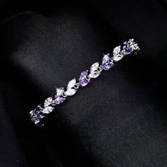 Romantic. Classy. Delicate. Rhodium plated for a flawless finish which perfectly enhances the intricate detailing, this exquisite bracelet will add a touch of sophistication to any wedding gown or formal ensemble. Each link is adorned with flawlessly faceted purple and clear cubic zirconia that capture the light from every angle with a perfectly translucent appeal, sparkling beautifully. Available in two lengths: 6.5" (approx. 16.5cm) and 7.75" (approx. 19.6cm). To make your choice select your p Make Your Choice, Floral Heels, Bridal Belt, Matching Jewelry, Bridal Bracelet, Bridal Hair Comb, Bridal Tiara, Simple Bags, Bridal Jewelry Sets