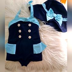 Janie And Jack Girls Retro Navy Blue Ruffle Nautical Uva Safe One-Piece Swimsuit, Size 6-12 Months. Has Tags. Never Worn. Pristine Condition. Matching Blue Hat Alao Uva Safe. Size 12-24 Months With A Chin Strap. Blue Cotton Beach Hat, Navy Nautical Beach Hat, Nautical Navy Beach Hat, Navy Cotton Beach Hat, Fitted Blue Hat For Beach, Playful Blue Cotton Hats, Playful Blue Hat For Vacation, Playful Blue Hats For Vacation, Blue Adjustable Hat For Playtime