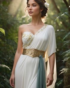 Create a portrait of a goddess-like female figure in a tranquil, forested environment. She has an elegant appearance with long, wavy hair styled in an updo and adorned with a delicate, floral headband. She wears a flowing, ancient Greek-inspired gown in a soft, pale color, featuring a one-shoulder design and draped fabric that accentuates her graceful form. The outfit includes a decorative belt with ornate gold detailing, and she holds a bow in her hand, with a quiver of arrows slung over her... White Ancient Greek Dress, Ancient Roman Female Clothing, Greek Goddess Dress Pattern, Greek Princess Aesthetic, Roman Goddess Costume, Ancient Greek Dress, Quiver Of Arrows