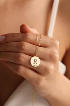 "Here is the super elegant initial necklace. You may design your necklace with any letter and dates as you want. This letter necklace is fully customizable and proper for any combine. This gold letter necklace is one of our favorite design and great gift idea for women. Gold Name Necklace is the most beautiful gift in the world. The easiest way to make a woman happy may be to order her a timeless letter necklace.  This personalized necklace would make a wonderful personalized Christmas gift, birthday gift, anniversary gift. The gold name necklace is a durable solid necklace. First quality materials are used while producing our letter necklaces.  Our chains are produced by hand with a special system. It has a solid form. All our jewelry is %100 custom made by hand with Love and Care in our Personalized Monogram Initial Necklace Round Pendant, Personalized Monogram Initial Pendant Name Necklace, Personalized Monogram Initial Pendant Necklace, Initial Pendant Necklace With Name For Her, Minimalist Initial Pendant Necklace As Anniversary Gift, Minimalist Initial Pendant Necklace For Anniversary Gift, Minimalist Initial Necklace With Custom Name, Minimalist Personalized Letter Charm Necklace, Minimalist Initial Pendant Name Necklace For Anniversary