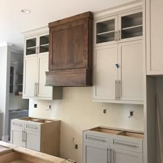 an unfinished kitchen with cabinets and drawers