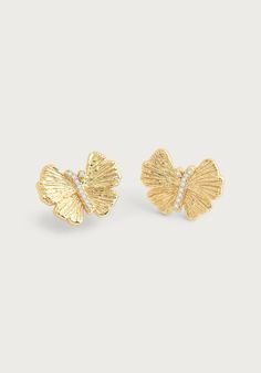 These hand sculpted butterfly studs are crafted in 18k gold dipped brass and accented with hand-set crystals. These beautiful and exquisitely made earrings are timeless addition to your everyday wardrobe. Add a touch of elegance and sparkle to your outfit with these hand-crafted butterfly studs. Made with 18k gold dipped brass and adorned with hand-set crystals, these earrings are a luxurious must-have for your everyday look. 18K Gold Plated Brass Crystal 0.7" L x 0.5" H Stud Gold Earrings, Real Butterflies, Ginkgo Leaves, Butterfly Earrings Stud, Butterfly Jewelry, Gold Dipped, Sparkling Crystal, Everyday Wardrobe, Ring Bracelet