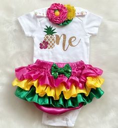 This listing is for Baby girl's Summer/Hawaiian theme First Birthday outfit . Includes - White Bodysuit, Bloomerskirt (ruffles all around )and headband . All outfits are made to Order and Standard PROCESSING time is 2 weeks. *Processing time DOES NOT INCLUDE SHIPPING TIME. U.S. SHIPPING is based on the method of shipping you choose at checkout in the drop down menu: Standard (first class mail): 4-6 business days Priority Mail: 2-4 business days There are faster options too! **Washing Instruction First Birthday Fitted Sets With Ruffles, Summer Birthday Sets With Ruffles, Summer Birthday Ruffled Sets, Fun Pink Sets For First Birthday, Fun Summer Sets For First Birthday, Fun First Birthday Sets For Summer, Fun Summer First Birthday Set, Fun First Birthday Summer Sets, Fitted Sets For Birthday And Summer