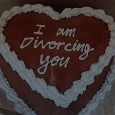 a heart shaped cake with the words i am divoring you written on it