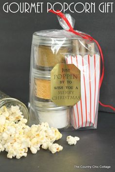 popcorn gift in a jar with the words just popin by to wish you a merry christmas