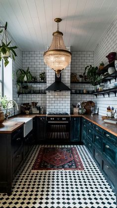 a black and white checkered floor in a kitchen with an old fashioned light fixture